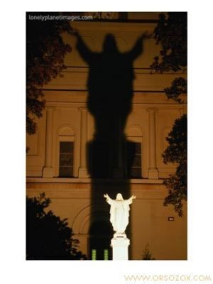 Statue-of-Christ-with-Shadow-on-St-Louis-Cathedral-New-Orleans-Louisiana-USA-Photographic-Print-C12653443.jpg